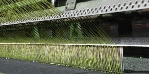 Premium 11000 Pile Dtex Football Artificial Grass with UV Resistance and Perforation Drainage Holes